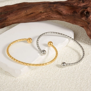 304 stainless steel open bangles in gold and silver finish with textured diamond patterns