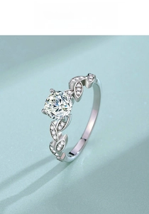 Detail view of S925 silver leaf ring with moissanite center stone and pavé accents