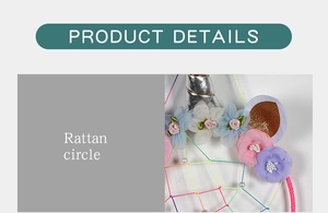 Close-up of unicorn dream catcher featuring rattan circle and colorful fabric flowers