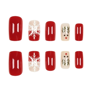 Christmas press-on nails featuring red and white snowflakes and cute reindeer designs