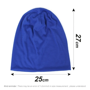Flat lay photo of blue knitted beanie showing dimensions 27cm height and 25cm width