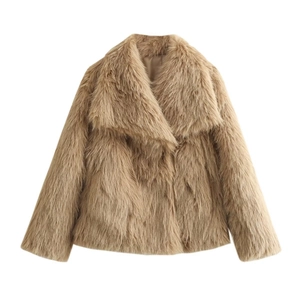Detailed view of the fluffy long-haired faux fur texture on a khaki oversized coat