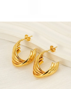 Detailed macro view of 18K gold plated multi-layer twisted hoop earrings with glossy finish