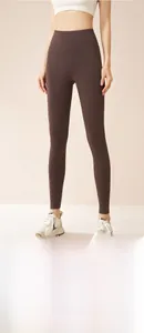 Close-up of high-waisted coffee brown thermal yoga leggings with tummy control and lifting effect