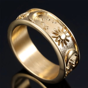 Polished gold stainless steel ring with embossed celestial sun, moon and star patterns