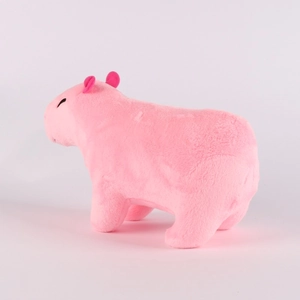Close-up of side view pink capybara plush toy with soft short fur and realistic design