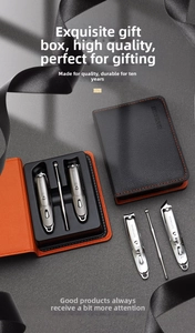 Macro shot of a professional stainless steel manicure set in a black and orange leather case