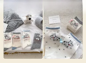 Close-up of cute cartoon animal socks featuring 3D bow decorations and soft cotton texture