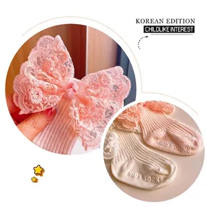 Baby girl lace bow socks set in pink and beige with anti-slip grip dots on soles