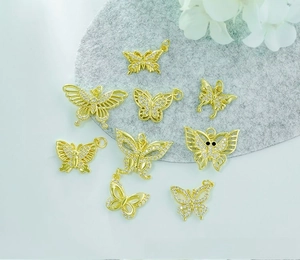 Detail of 18K gold-plated butterfly charms set with cubic zirconia for DIY jewelry