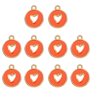 Detail view of ten orange and gold hollow heart charms for DIY jewelry making