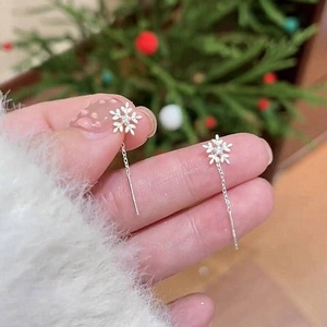 Elegant silver snowflake earring threads with shimmering zircon stones on a long chain