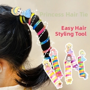 Gros plan d'élastiques à cheveux spirales colorés avec des breloques de princesse