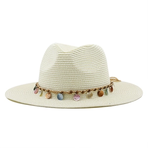 Detailed weave pattern on beige straw jazz hat with multi-color bohemian sequin trim