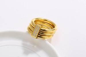 Detail of 18k gold plated triple-layer ring with sparkling CNC set zircon stones