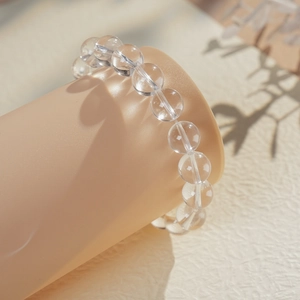 Macro detail of transparent white crystal beads with high-clarity polish on display