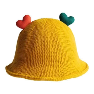 Cute yellow knit bucket hat for baby girls with 3D heart decorations on white background