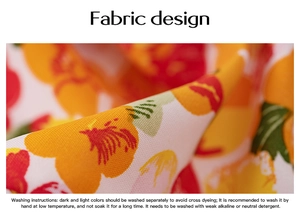 Detail of floral fabric pattern with washing instructions for long sleeve V-neck dress