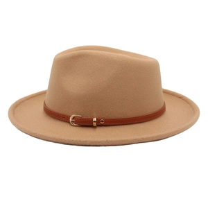 Detail of wool fedora hat featuring a brown faux leather band and golden buckle