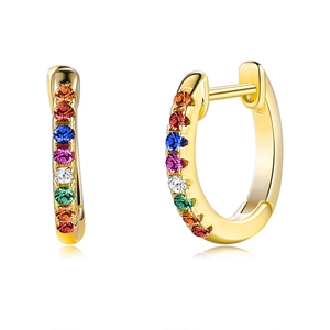 Macro detail of gold-plated S925 sterling silver hoop earrings with rainbow zircons