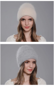 Close-up of a premium fluffy Angora rabbit fur beanie shown on a model in cream and grey