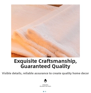 Detail of white plush table runner showing the soft texture and hemmed sewing edge