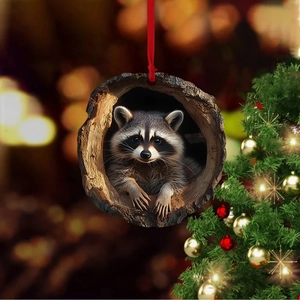 Detailed close-up of 2D acrylic raccoon Christmas ornament with a red silk hanging ribbon