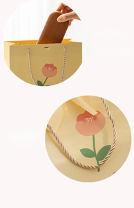 Close-up of tulip gift bag handles and capacity detail with braided rope textures