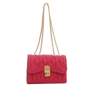 Chic magenta quilted chain shoulder bag with a rectangular gold clasp for daily wear