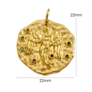 Detail of 22mm gold Gemini zodiac charm with hammered texture and colorful crystals