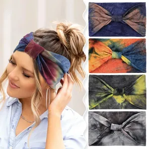 Close-up of wide tie-dye sports headbands with twist knot detail and elastic fabric texture
