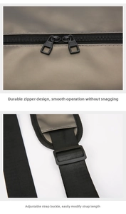 Close-up of dual metal zippers and adjustable woven strap on gray waterproof gym bag