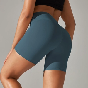 Close-up of the peach lift effect and flatlock seams on high-waist charcoal yoga shorts