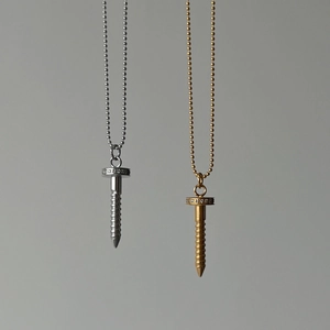 Detail view of silver and gold plated screw necklaces with zircon pavé on cable chains