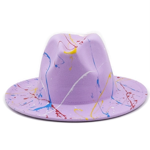 Detailed close-up of light purple felt fedora hat featuring colorful paint splatter patterns