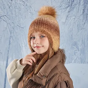 Kids winter knit hat with pompom and ear flaps featuring a yellow gradient design