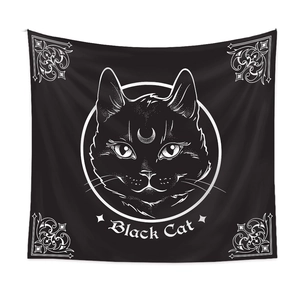 Detail view of Bohemian black cat tapestry with moon symbol and white line art