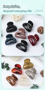Close-up of assorted matte and glossy hair claw clips in various colors and textures