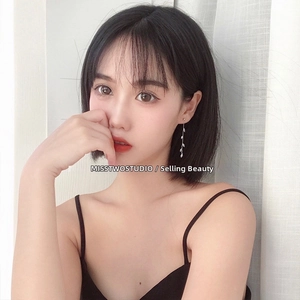 Detailed view of silver zircon leaf tassel earrings showing elegant long drape design