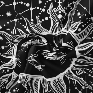 Detailed close-up of Bohemian sun and celestial patterns on high-quality fabric tapestry