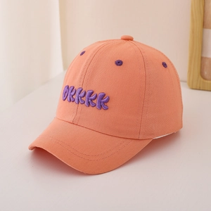 Detailed embroidery of purple letters on a vibrant orange kids baseball cap