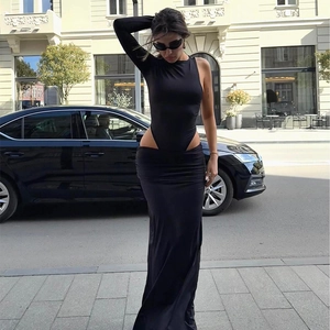 Women's black one-shoulder cropped top and high-waisted slit long skirt two-piece set