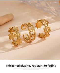 Detail showing three adjustable golden flower rings with daisy and sunflower designs