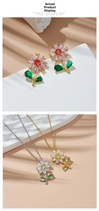 Detailed set of floral titanium necklaces and matching earrings with zircons in macro view