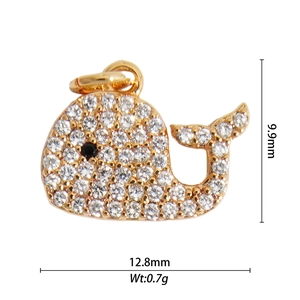 Macro shot of 9.9x12.8mm gold whale pendant with zircon pave and dimensions