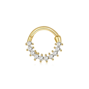 Close-up of golden seamless cartilage hoop ring with sparkling clear gemstones on white background