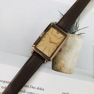 Elegant rectangular rose gold women's watch with brown leather strap and champagne dial