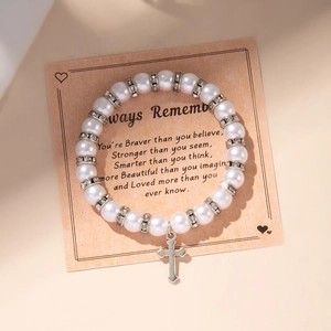 Faux pearl beaded bracelet with rhinestone spacers and metal cross pendant on display card