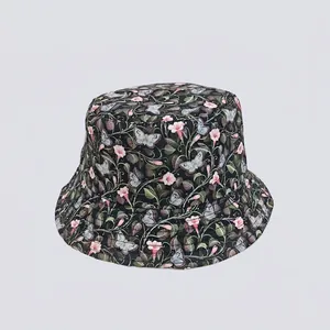 Close-up of a floral bucket hat featuring pink flowers and blue butterfly prints