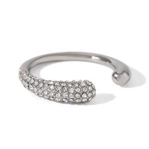 Detailed close-up of a silver open ring featuring a dense micro-pave setting with rhinestones